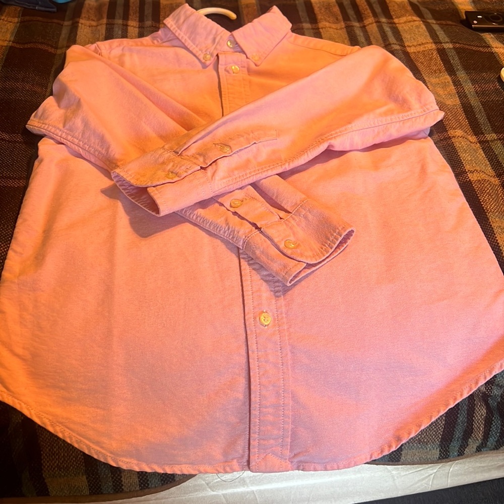 A pink button down girls shirt